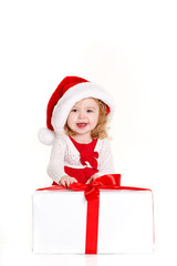 little girl in a cap of Santa Claus isolated on white background