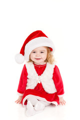 little girl in a cap of Santa Claus isolated on white background