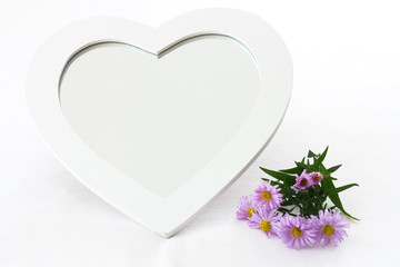 Heart shaped mirror in frame