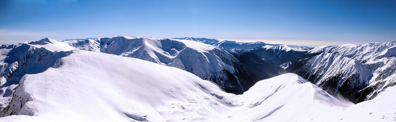 Fototapeta na wymiar panorama over mountain ridges in winter
