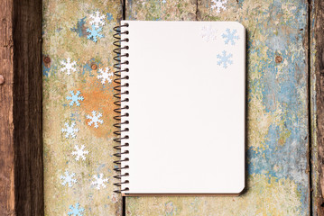 Christmas background with empty notepad on wood