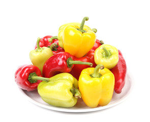 Collection of colored paprika in a white plate