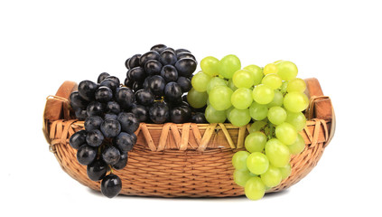 Black and green grapes in basket.