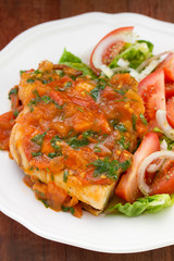 chicken with tomato sauce and salad