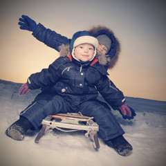 happy boys on sled