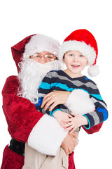 Classic Santa Claus hugging little boy.