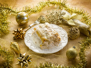 cannelloni over golden christmas table