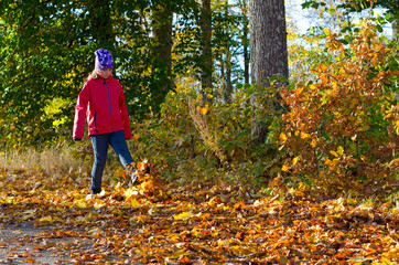 Playing with autumn leaves