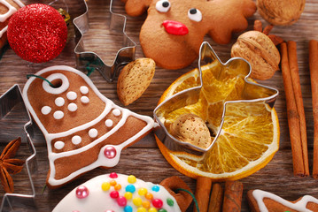 christmas background with gingerbread cookies ,cutters and spice