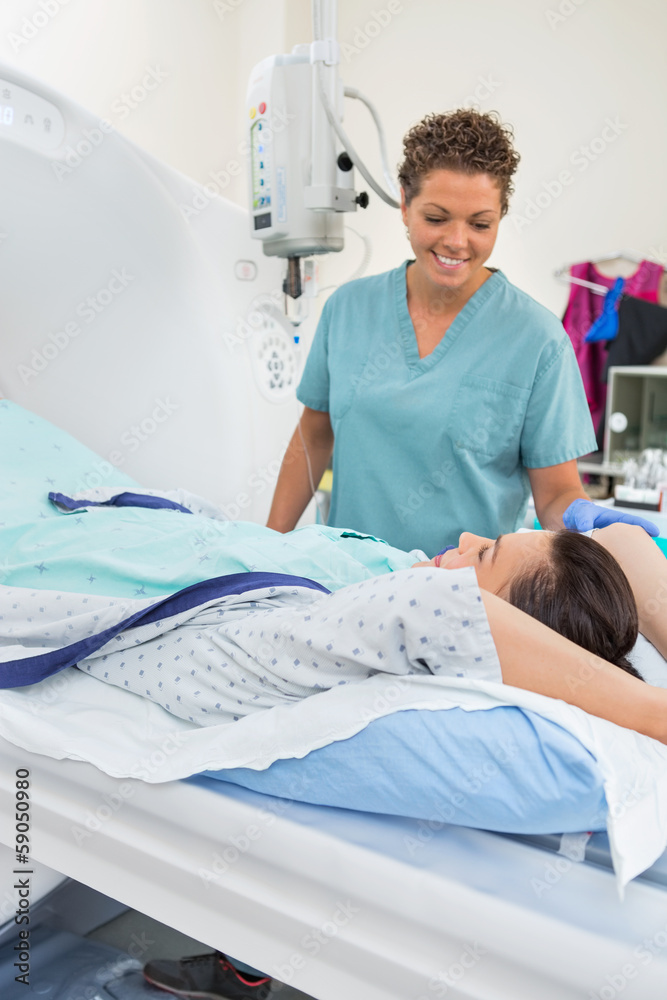 Wall mural nurse preparing patient for ct scan