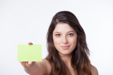 Beautiful woman showing a paper note