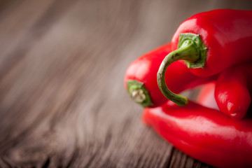 Fresh red chilli on a wooden table