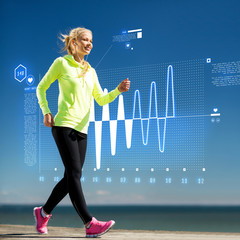 smiling woman doing sports outdoors with earphones