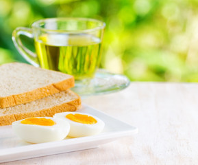 Boiled eggs, toasts and cup of tea.