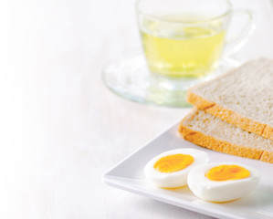 Boiled eggs, toasts and cup of tea.