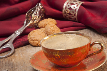 Cup of coffee on old wood