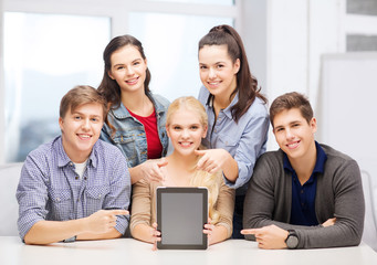 smiling students with blank tablet pc screen