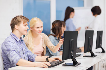 students with computer monitor at school