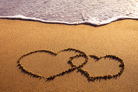 valentines day card, two hearts on the beach