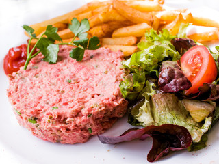 classic steak tartare on white plate