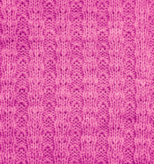 Fototapeta na wymiar pink knitted fabric as a background. macro
