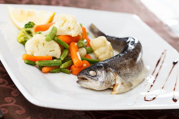 trout served with mixed vegetables