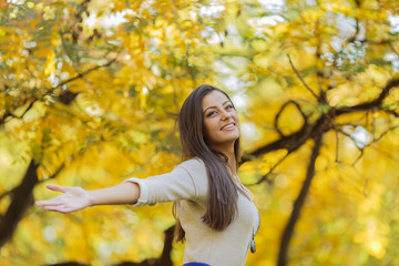 Young woman in the autumn forest