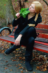 Beautiful blonde on a park bench © GieZetStudio