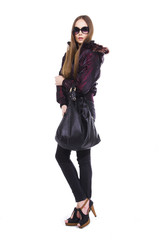 beautiful girl with long hair with bag is in fashion style