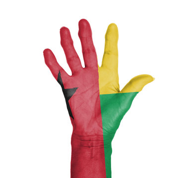 Palm of a woman hand, painted with flag