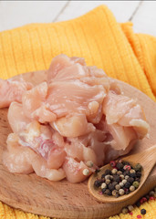 Fresh chicken on wooden table