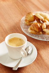 Having coffee and croissants