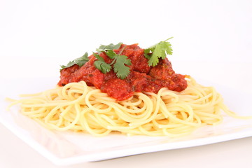 Pasta with meatballs decorated with coriander