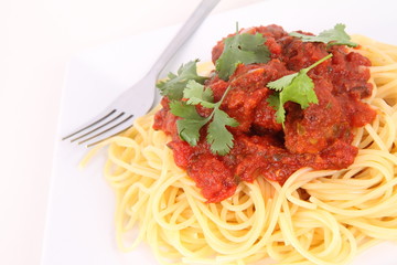 Pasta with meatballs decorated with coriander