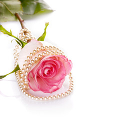 Pink rose and pearl beads.