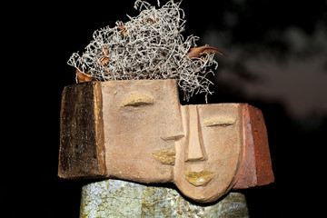 the flower pot in the form of the feminine head