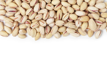 border from roasted salty pistachios nuts