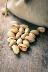 roasted and salted pistachios pour out of the bag