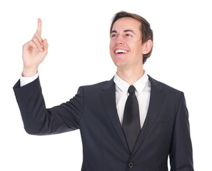 Confident young businessman smiling and pointing finger