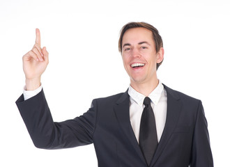 Young businessman smiling and pointing finger