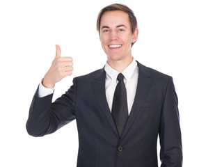 Successful young businessman showing thumbs up