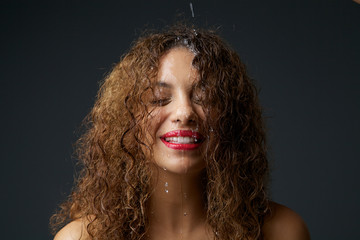 Fototapeta premium African american girl with water dripping down face