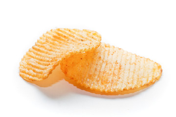 Two spiced potato chips on white background