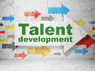 Education concept: arrow with Talent Development on grunge wall