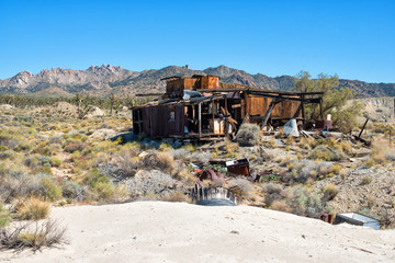 Old wooden abandoned house in the desert