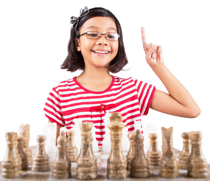 Little Girl Playing Stone Made Chess Set