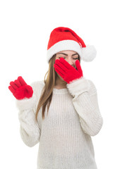 Sleepy young woman wearing Christmas hat and gloves