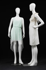 Two elegant sundress on a mannequin –black background