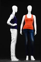 Two mannequin dressed in shirt and trousers