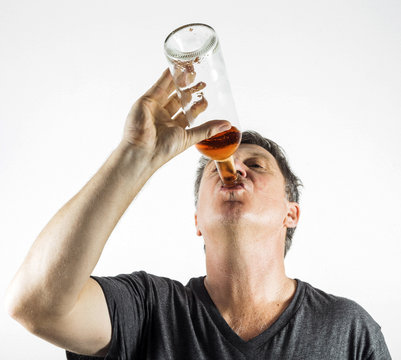 man drinking alcohol